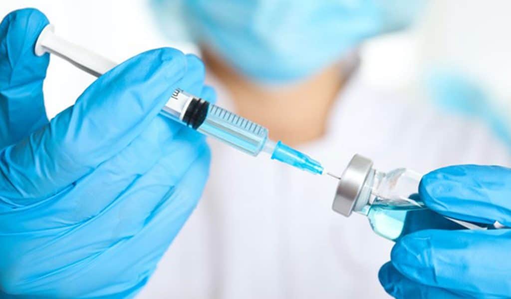 medic with vaccine